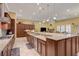 Open concept kitchen featuring gas range and granite countertops with view to the living area at 4260 Helena Cove Ct, Las Vegas, NV 89129