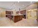 Spacious kitchen features a large island, stainless steel appliances, and seamless flow to the home's entrance at 4260 Helena Cove Ct, Las Vegas, NV 89129