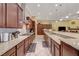 Gourmet kitchen showing the gas cooktop and granite countertops with custom backsplash and stainless steel appliances at 4260 Helena Cove Ct, Las Vegas, NV 89129