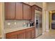 A detail of custom cabinetry and countertops, and stainless steel appliances in a well-appointed gourmet kitchen at 4260 Helena Cove Ct, Las Vegas, NV 89129