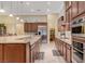Gourmet kitchen showcasing stainless steel appliances and granite countertops, perfect for culinary enthusiasts and entertaining at 4260 Helena Cove Ct, Las Vegas, NV 89129