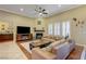 Bright living room featuring hardwood flooring, fireplace, and plantation shutters at 4260 Helena Cove Ct, Las Vegas, NV 89129