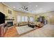 Spacious living room with hardwood floors, fireplace, and large windows at 4260 Helena Cove Ct, Las Vegas, NV 89129