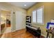 Home office features wood floors and a window with white shutters at 4260 Helena Cove Ct, Las Vegas, NV 89129