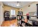 Bright home office featuring wood floors and a window with white shutters at 4260 Helena Cove Ct, Las Vegas, NV 89129