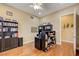 Office features wood floors, ceiling fan and custom shelves for ample storage at 4260 Helena Cove Ct, Las Vegas, NV 89129