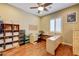 Office features wood floors, ceiling fan and desk with sewing machines at 4260 Helena Cove Ct, Las Vegas, NV 89129