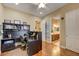 Office with hardwood floors leads to bathroom with double sink vanity at 4260 Helena Cove Ct, Las Vegas, NV 89129