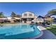 Spacious backyard featuring a pool, outdoor seating area, well-manicured lawn and an inviting layout for entertainment at 4474 Dawley Ct, Las Vegas, NV 89104