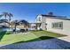 Backyard featuring a pool, outdoor seating area and lush greenery, perfect for relaxation and entertainment at 4474 Dawley Ct, Las Vegas, NV 89104