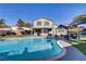 Spacious backyard featuring a pool, outdoor seating area, well-manicured lawn and an inviting layout for entertainment at 4474 Dawley Ct, Las Vegas, NV 89104