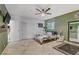 A cozy bedroom features a decorative fan, tile flooring, and ample closet space for storage at 4474 Dawley Ct, Las Vegas, NV 89104