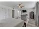 Large bedroom features a seating area, wood-style flooring, and modern amenities at 4474 Dawley Ct, Las Vegas, NV 89104