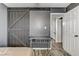 Bedroom featuring a large sliding barn door and a workstation at 4474 Dawley Ct, Las Vegas, NV 89104