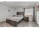 Bedroom with natural light, modern decor, and sleek wood-style flooring at 4474 Dawley Ct, Las Vegas, NV 89104