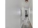 Hallway with gray wood floors and white walls leads to other rooms at 4474 Dawley Ct, Las Vegas, NV 89104