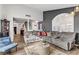 Spacious living room with comfortable sofa, stylish decor, and plenty of natural light at 4474 Dawley Ct, Las Vegas, NV 89104