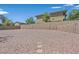 Expansive gravel backyard with tall block wall at 4583 Sparwood Dr, Las Vegas, NV 89147