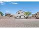Gravel backyard with block wall surrounding the perimeter and house in the background at 4583 Sparwood Dr, Las Vegas, NV 89147