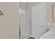 Bathroom featuring a walk-in shower with white tile and a glass door at 4583 Sparwood Dr, Las Vegas, NV 89147