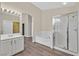 Main bath showcasing dual sinks, walk-in shower, soaking tub and closet at 4583 Sparwood Dr, Las Vegas, NV 89147