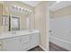 Bathroom featuring dual sinks, modern lighting and shower and bath combo at 4583 Sparwood Dr, Las Vegas, NV 89147