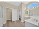 Main bath showcasing dual sinks, soaking tub, and separate glass shower at 4583 Sparwood Dr, Las Vegas, NV 89147