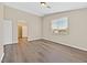 Bedroom showcasing wood floors, a window with blinds, and an open closet at 4583 Sparwood Dr, Las Vegas, NV 89147