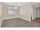 Cozy dining room with wood-look floors and natural light from the window at 4583 Sparwood Dr, Las Vegas, NV 89147