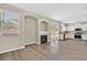 Open-concept living room featuring a fireplace, sliding glass doors, and kitchen at 4583 Sparwood Dr, Las Vegas, NV 89147