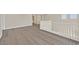 Spacious living room showcasing wood floors and modern white railing at 4583 Sparwood Dr, Las Vegas, NV 89147