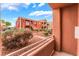 Balcony view showcasing the condo complex with desert landscaping and clear blue skies at 4730 E Craig Rd # 1115, Las Vegas, NV 89115