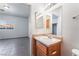 Bathroom featuring a wooden sink, a window and tile flooring that flows into adjacent room at 4730 E Craig Rd # 1115, Las Vegas, NV 89115