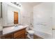 Clean bathroom featuring a single sink, toilet and tub with white tile at 4730 E Craig Rd # 1115, Las Vegas, NV 89115
