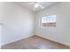 A well-lit bedroom featuring a large window and tile flooring at 4730 E Craig Rd # 1115, Las Vegas, NV 89115