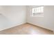 Neutral bedroom with tile floors, a large window, and bright walls at 4730 E Craig Rd # 1115, Las Vegas, NV 89115