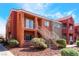 Exterior view of a two-story condo building with desert landscaping and stairs to upper units at 4730 E Craig Rd # 1115, Las Vegas, NV 89115