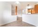 Bright, modern kitchen area with tile flooring and light colored cabinetry at 4730 E Craig Rd # 1115, Las Vegas, NV 89115
