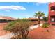 Exterior view showcasing the community landscape, including bushes and trees at 4730 E Craig Rd # 1115, Las Vegas, NV 89115