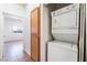 This laundry room has a stackable washer and dryer at 4730 E Craig Rd # 1115, Las Vegas, NV 89115
