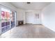 Bright living room showcasing tile floors, a fireplace, and a sliding glass door to the outside at 4730 E Craig Rd # 1115, Las Vegas, NV 89115