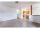 Bright living room with tile flooring connected to the kitchen with wood cabinets at 4730 E Craig Rd # 1115, Las Vegas, NV 89115