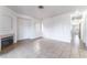 Spacious living room featuring neutral tile flooring, a fireplace, and white walls at 4730 E Craig Rd # 1115, Las Vegas, NV 89115