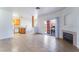 Open concept living area shows tile flooring, fireplace, and kitchen at 4730 E Craig Rd # 1115, Las Vegas, NV 89115