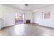 Open-concept living room featuring tile flooring, a fireplace, and a sliding glass door at 4730 E Craig Rd # 1115, Las Vegas, NV 89115