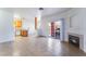 Open concept living area shows tile flooring, fireplace, and kitchen at 4730 E Craig Rd # 1115, Las Vegas, NV 89115