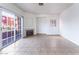 Bright living room showcasing tile floors, a fireplace, and a sliding glass door to the outside at 4730 E Craig Rd # 1115, Las Vegas, NV 89115