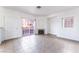 Open-concept living room featuring tile flooring, a fireplace, and a sliding glass door at 4730 E Craig Rd # 1115, Las Vegas, NV 89115