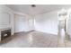 Spacious living room featuring neutral tile flooring, a fireplace, and white walls at 4730 E Craig Rd # 1115, Las Vegas, NV 89115