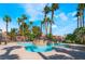 Community pool surrounded by palm trees at 4730 E Craig Rd # 1115, Las Vegas, NV 89115